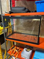 Full view of glass aquarium on shelf