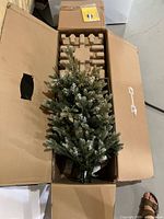 Tree sections inside original box with stand