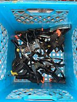 Top view inside crate showing multiple clamps of different sizes and materials