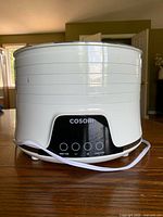 Front view of Cosori dehydrator showing control panel and cord