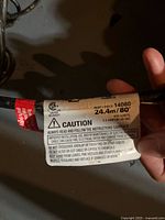 Label on heating cable showing 24.4 m / 80 ft, 400 W, 120 V rating