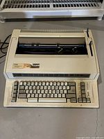 Front and top view of IBM Personal Wheelwriter 2 printer showing keyboard and overall condition