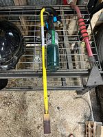 Yellow Mini Dragon wand, brass tip, red hose and Bernzomatic torch head on cylinder on shelf