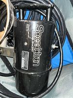 Close-up of Speedtron 102 strobe showing branding and cable
