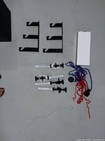 Overall view of brackets, support arms, chains, boxed hardware