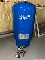 Full view of Water Worker blue pressure tank with assembly attached