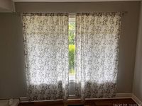 Full window view with both curtain panels on rod