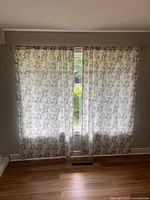 Full view of both curtain panels hung on rod