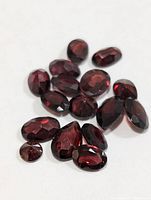 Close view of loose faceted garnet gemstones