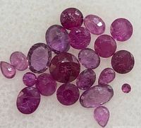 Loose rubies spread out to show shapes and color