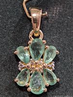 Front view of emerald flower pendant