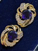 Front view of both earrings showing stone color and swirl design