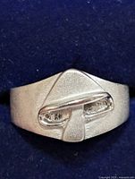 Front view showing geometric raised design of the silver ring