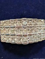 Front view of ring showing grid-set diamonds