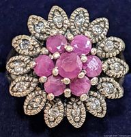 Top view showing ruby cluster and marcasite petals
