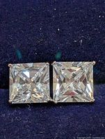 Front view of both square CZ stones in silver mounts