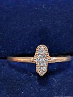 Front view of sterling silver ring showing vertical bar of CZ stones