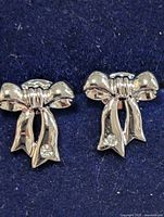 Both bow stud earrings front view showing design and stones