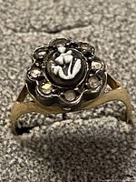 Ring front view showing cameo and diamond halo