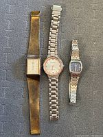 Front view of three wristwatches