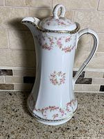 Front view of MZ Austria Bridal Rose chocolate pot showing pattern and shape