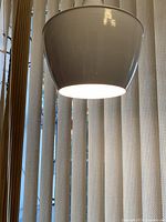 Pendant lit showing light output and shade interior