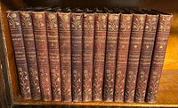 Full set of 13 leather-bound volumes on shelf