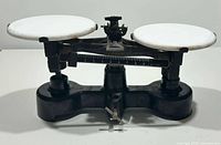 Full view of balance scale showing both pans and beam