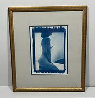 Full view of framed cyanotype print in gold frame