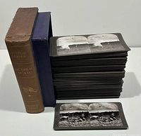 Stack of stereoview cards with book-form case and single card shown