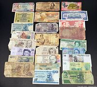 All banknotes laid out in grid showing full assortment