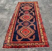 Full view of Persian carpet showing size, pattern and colors