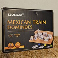 Front of unopened Elongdi Mexican Train Dominoes box, showing product details