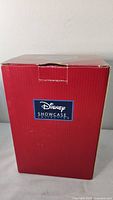 Front of red Disney Showcase Collection box