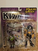 Front view of sealed KISS Psycho Circus Paul Stanley figure package with accessories visible