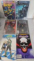 Six comics: Detective Comics #676, Batman Annual #28, two Batman issues, Green Arrow Rebirth, Batman Last Knight on Earth