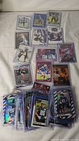 overview of entire lot of sleeved football cards