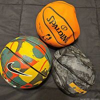 All three mini basketballs grouped together