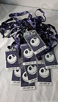 Pile of ten tagged Jack Skellington LED lanyards