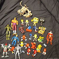 Group shot of entire assortment of figures laid on black fabric