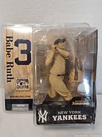 Front view of sealed Babe Ruth figure and backing card