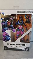 Front of sealed Overwatch Ultimates Lucio retail box showing figure and accessories