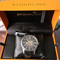 Watch in open orange Stuhrling presentation box