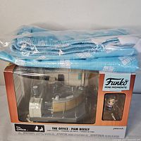 Boxed Funko Mini Moments set with folded pajama pants on top