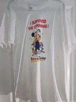 Full view of white T-shirt with front graphic and text