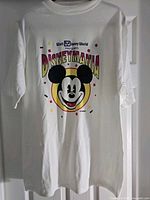 Front view of T-shirt showing Mickey Mouse Disney Mania graphic