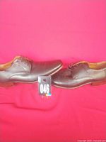 Pair of brown Florsheim dress shoes side view