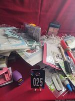Overview of mixed craft supplies on red background