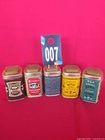 Group shot of five spice tins side by side