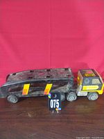 Side view of Tonka cab attached to trailer showing color, decals and wear